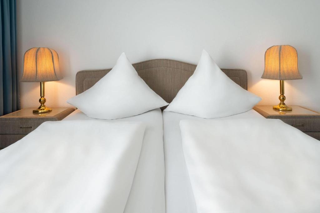 Das Doppelbett der Suite im Aspire Oldenburg