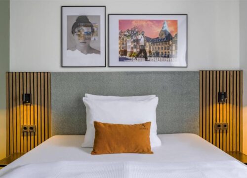 Das Bett eines Einzelzimmers im Aspire Palais Recklinghausen