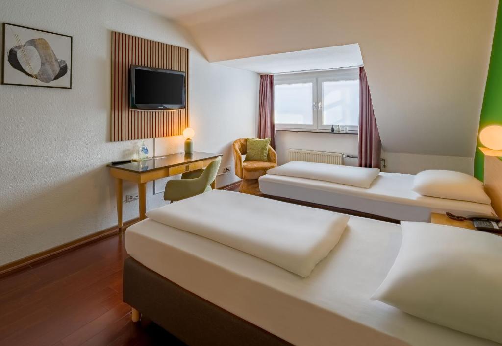 Das Twin-Zimmer mit Einzelbetten im rugs Hotel Düsseldorf